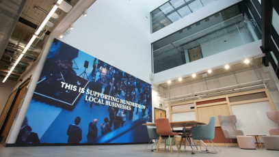 Atrium area with large screen and seating